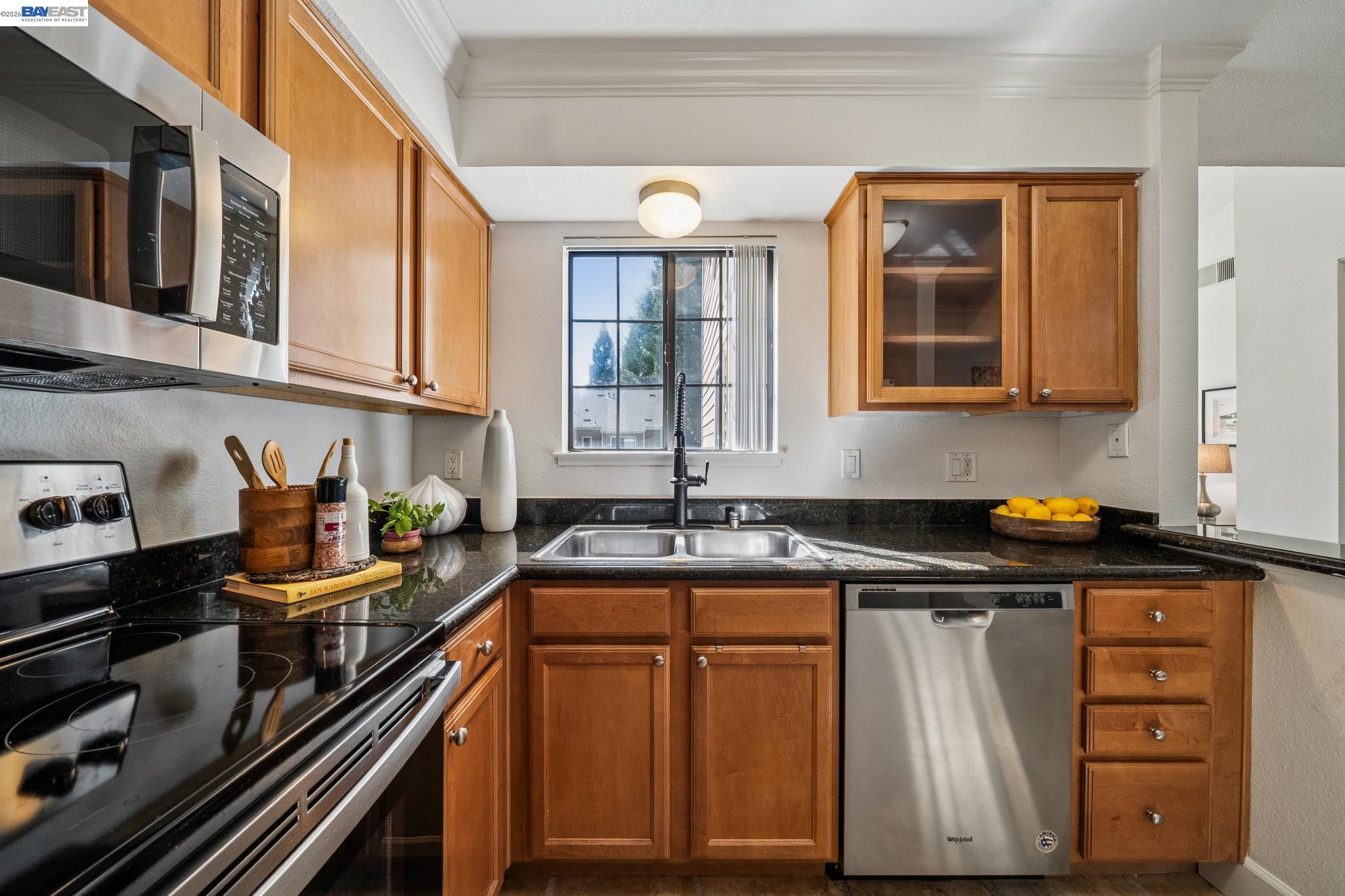 182 Eastridge Drive San Ramon, CA 94582 - Photo 14 of 54 a kitchen with granite countertop a stove sink and cabinets