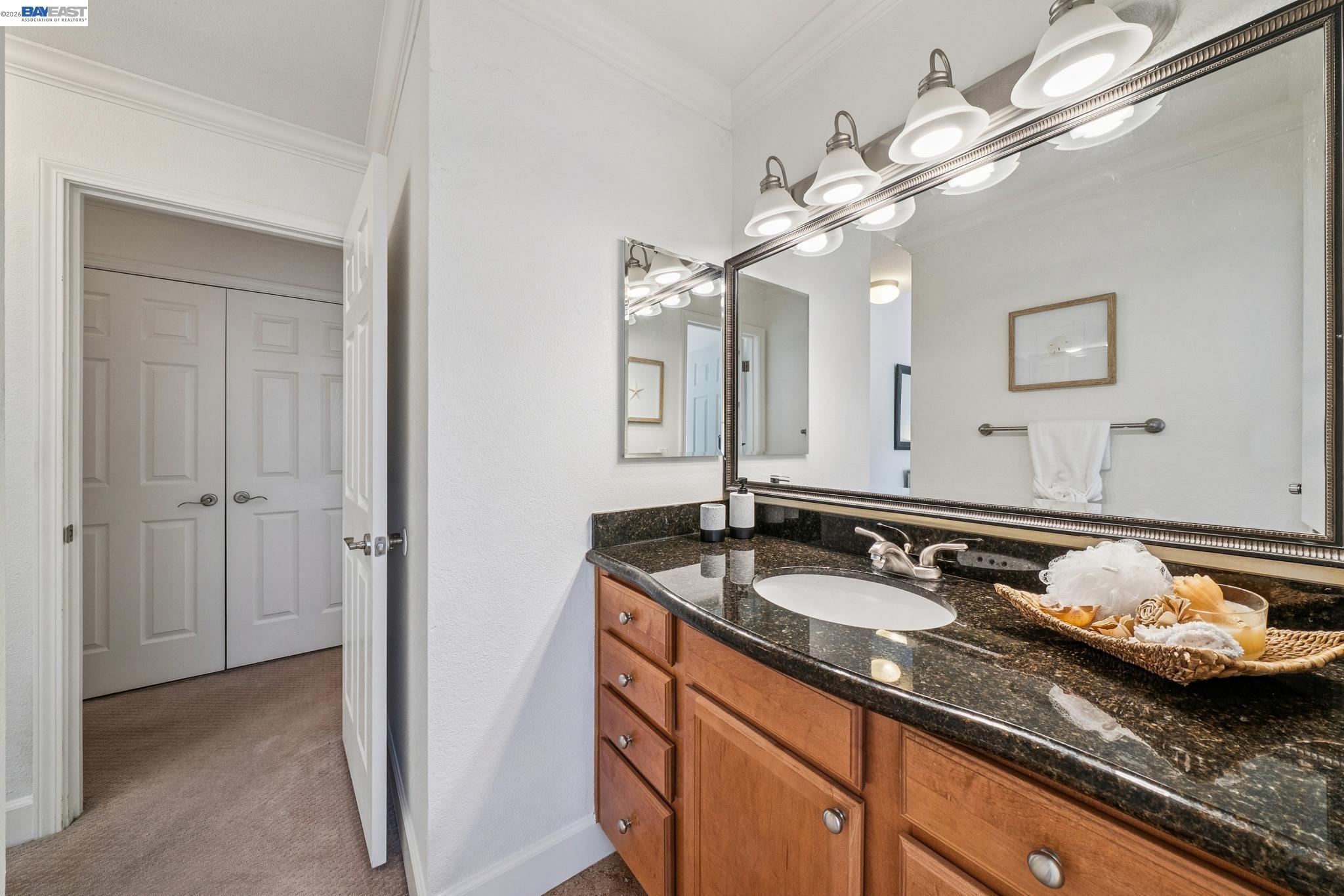 182 Eastridge Drive San Ramon, CA 94582 - Photo 24 of 54 a bathroom with a granite countertop double vanity sinks and a mirror