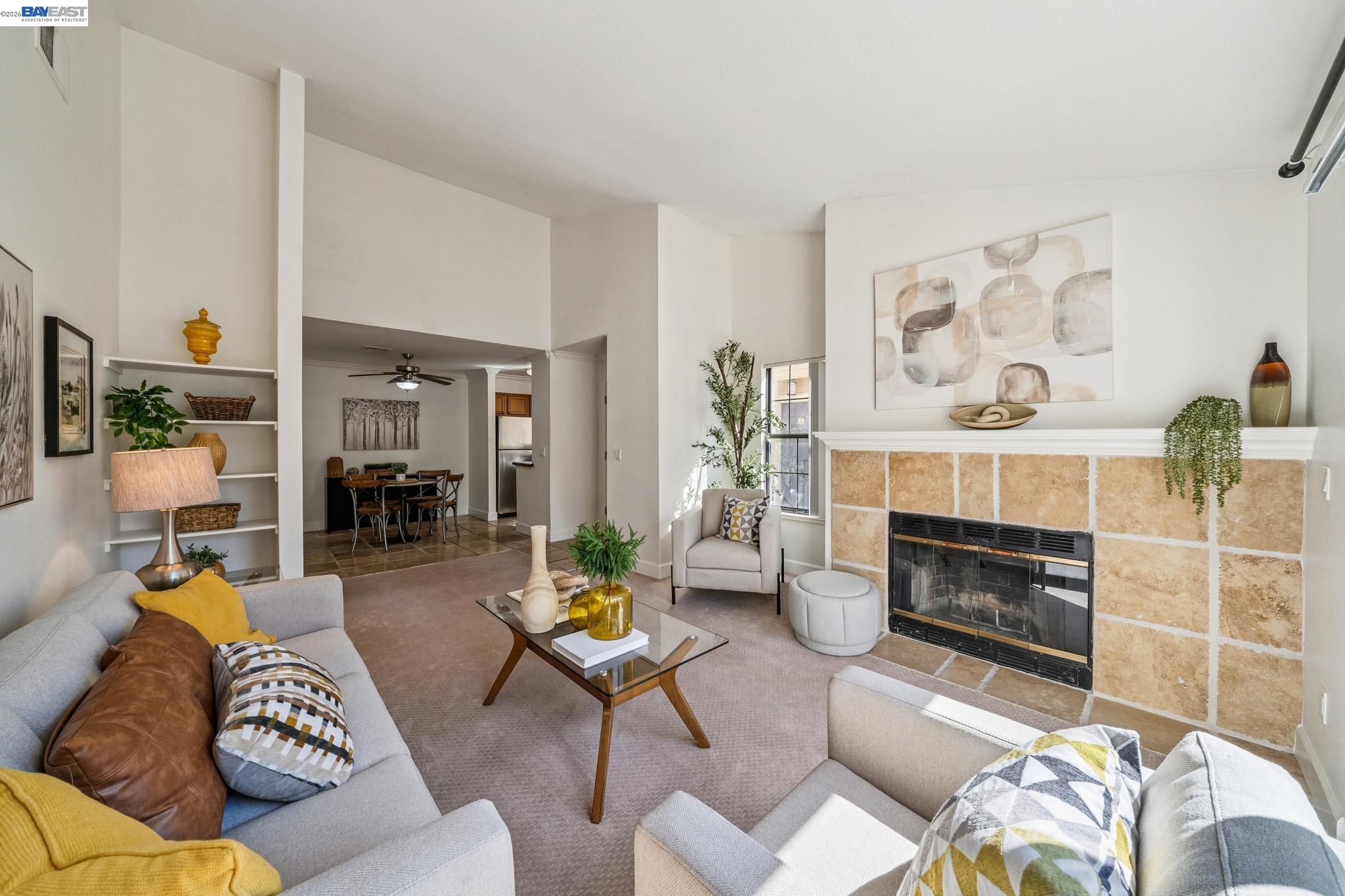 182 Eastridge Drive San Ramon, CA 94582 - Photo 6 of 54 a living room with furniture a fireplace and a dining table