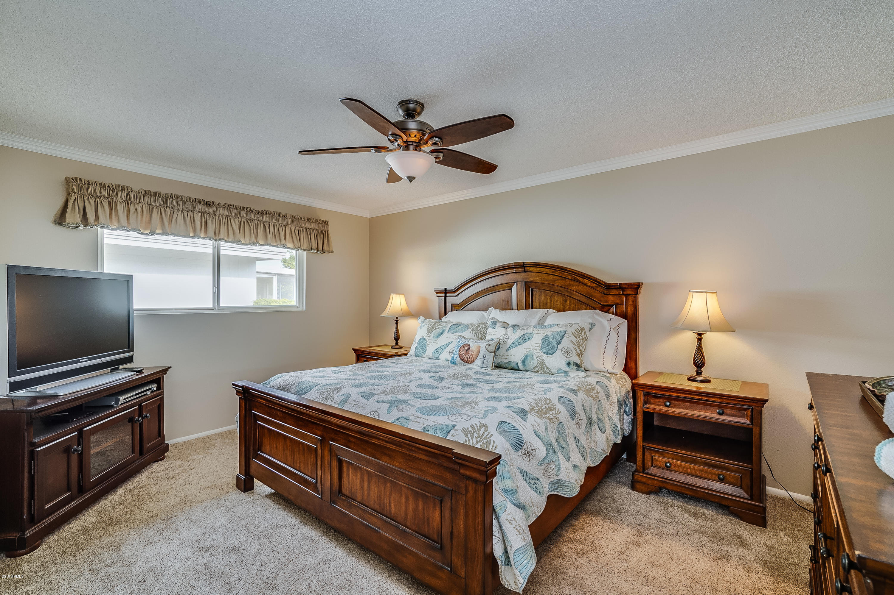 10460 West White Mountain Road Sun City, AZ 85351 - Photo 12 of 28 Master bedroom