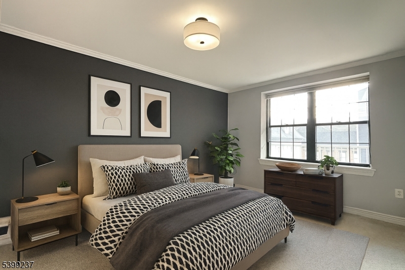 7 Prospect Street, Unit 507 Morristown, NJ 07960 - Photo 4 of 13 a bedroom with a bed and a window