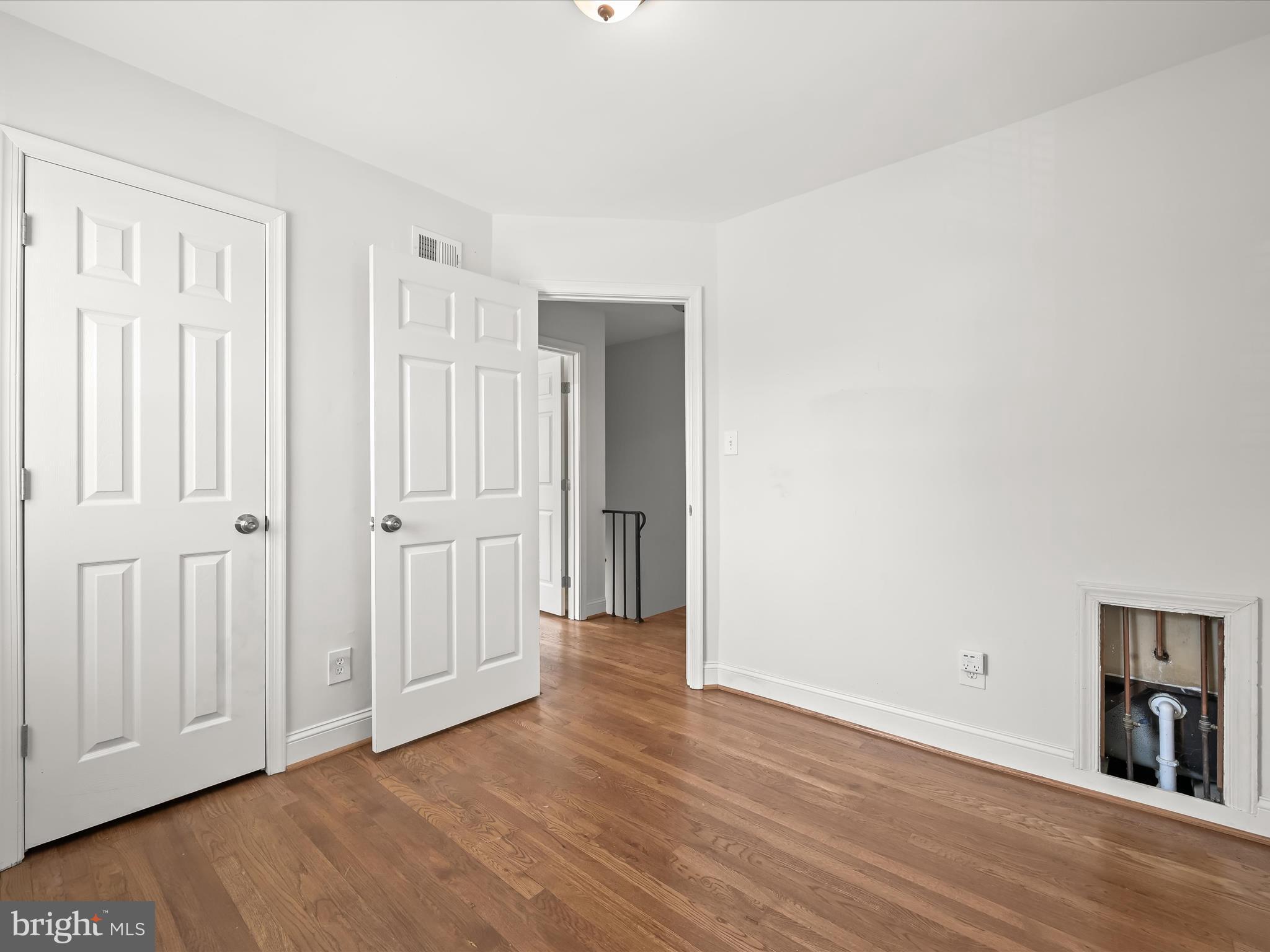 1776 East W Highway, Unit 1776 Silver Spring, MD 20910 - Photo 17 of 31 a view of a livingroom with wooden floor