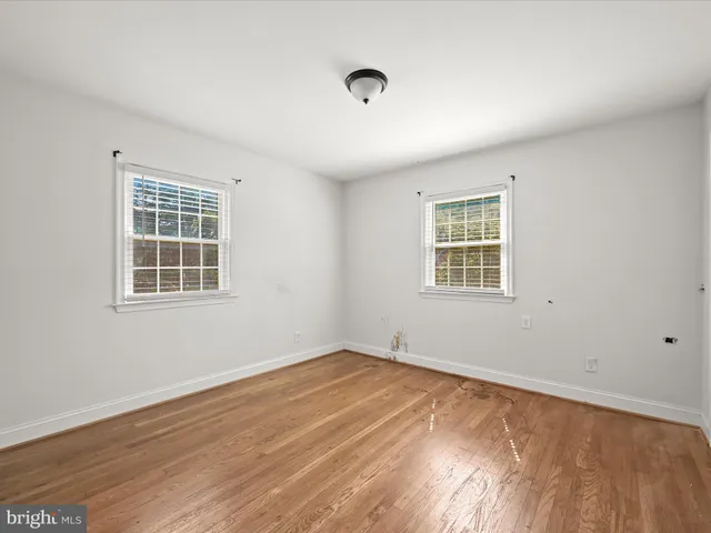 a view of empty room with windows