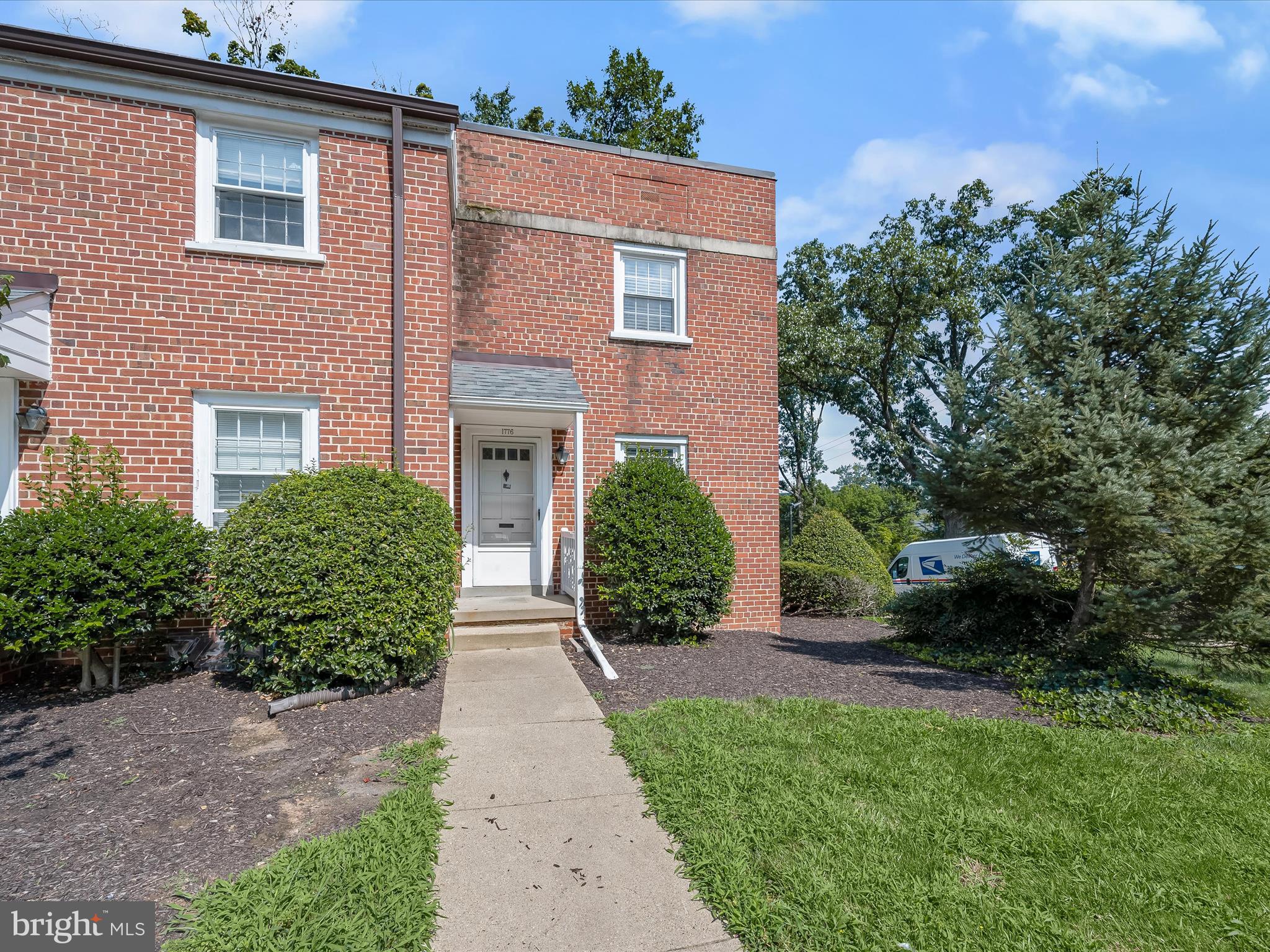 1776 East W Highway, Unit 1776 Silver Spring, MD 20910 - Photo 23 of 31 a front view of a house with a yard