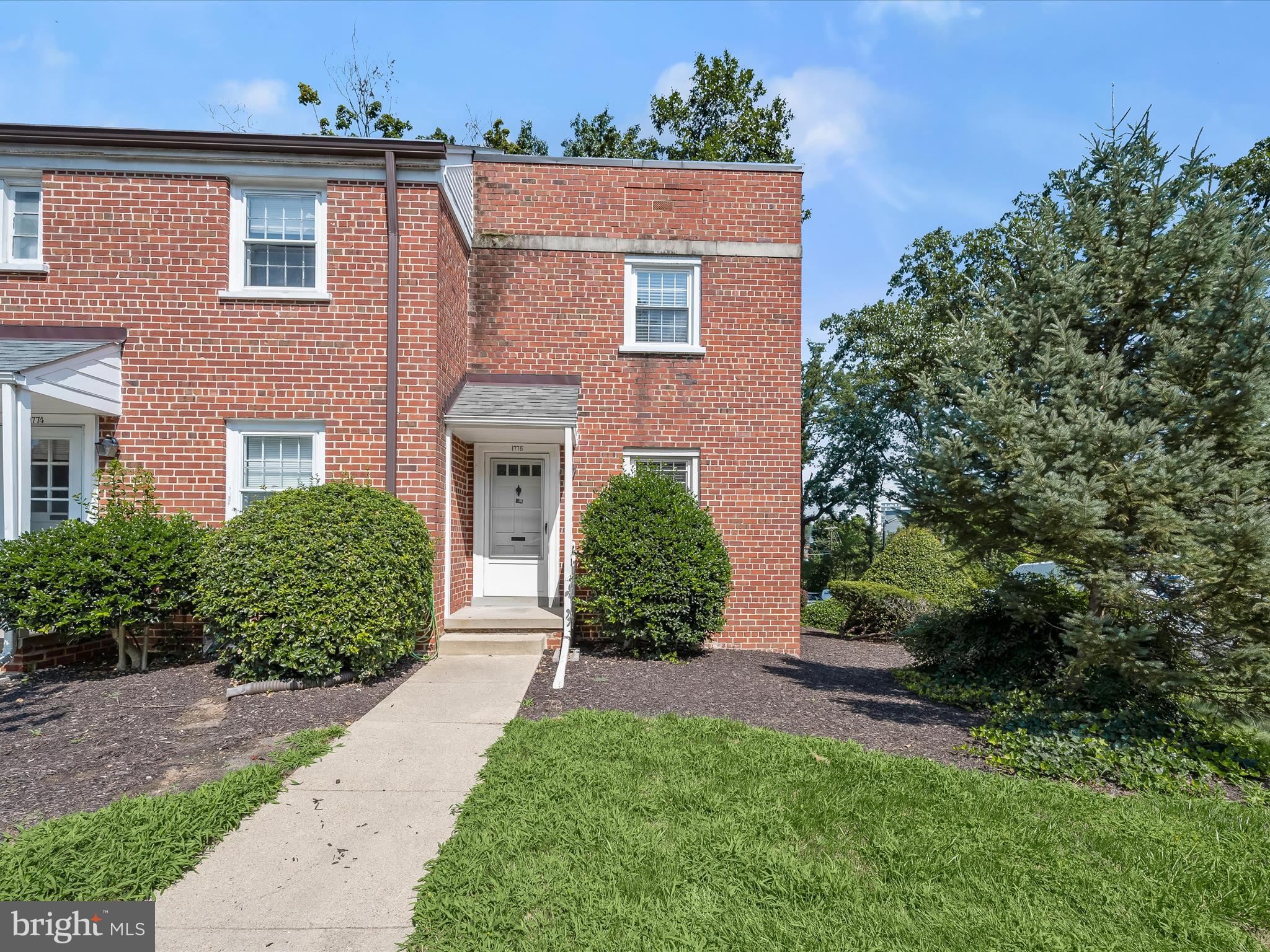 1776 East W Highway, Unit 1776 Silver Spring, MD 20910 - Photo 24 of 31 front view of a house with a yard