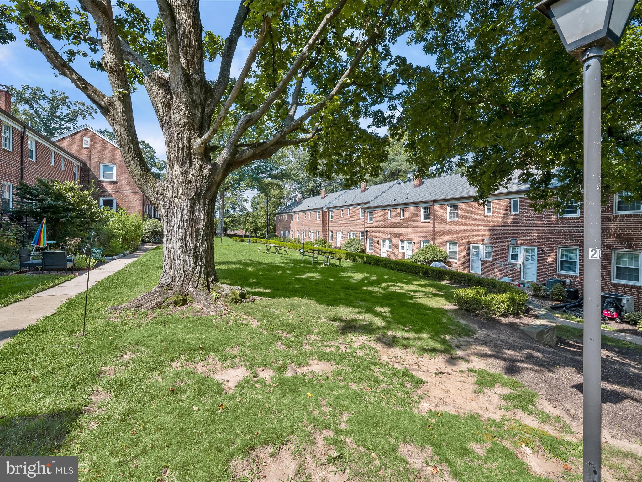 1776 East W Highway, Unit 1776 Silver Spring, MD 20910 - Photo 25 of 31 a view of a house with a yard
