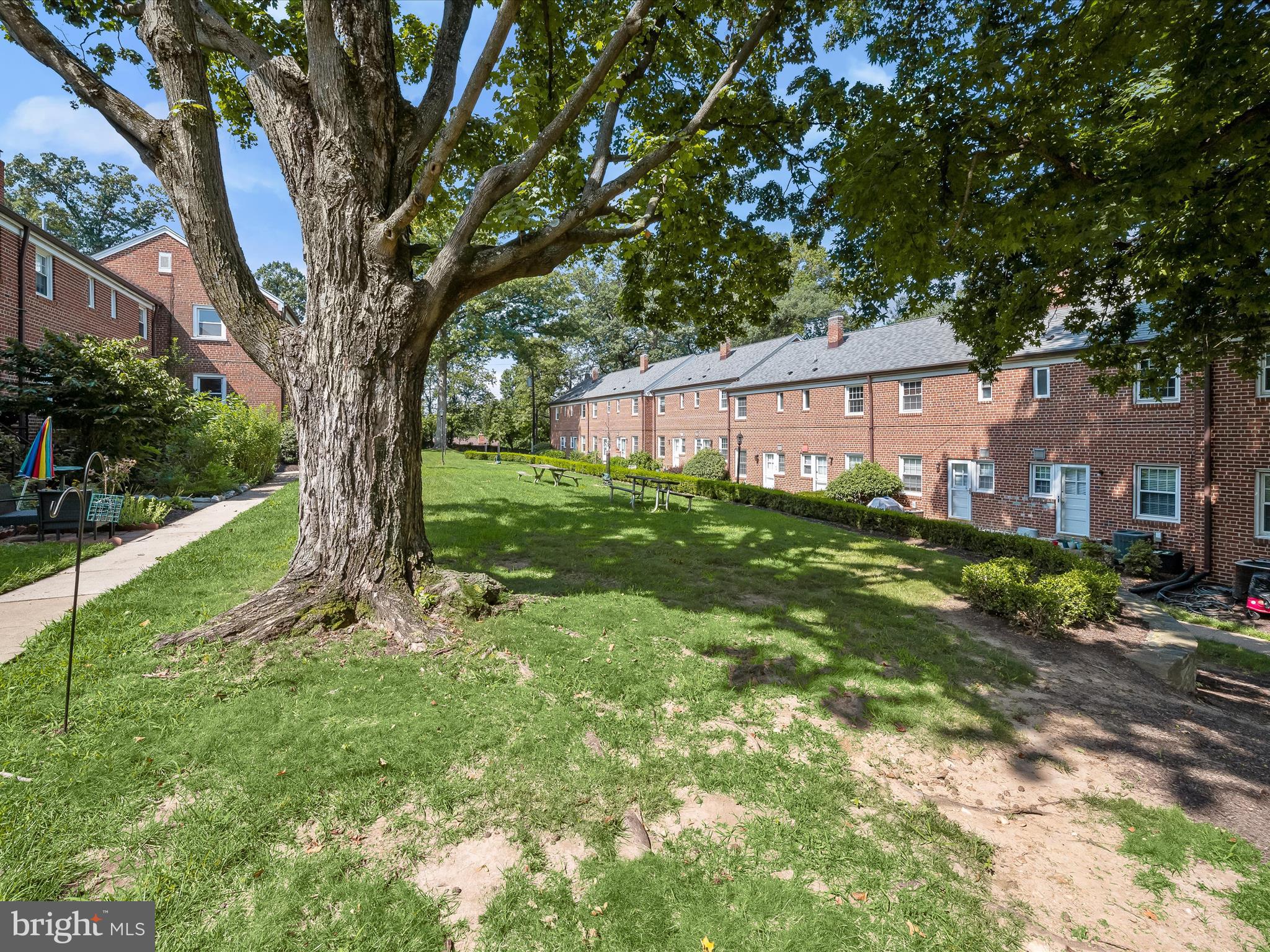 1776 East W Highway, Unit 1776 Silver Spring, MD 20910 - Photo 26 of 31 a view of a house with a yard