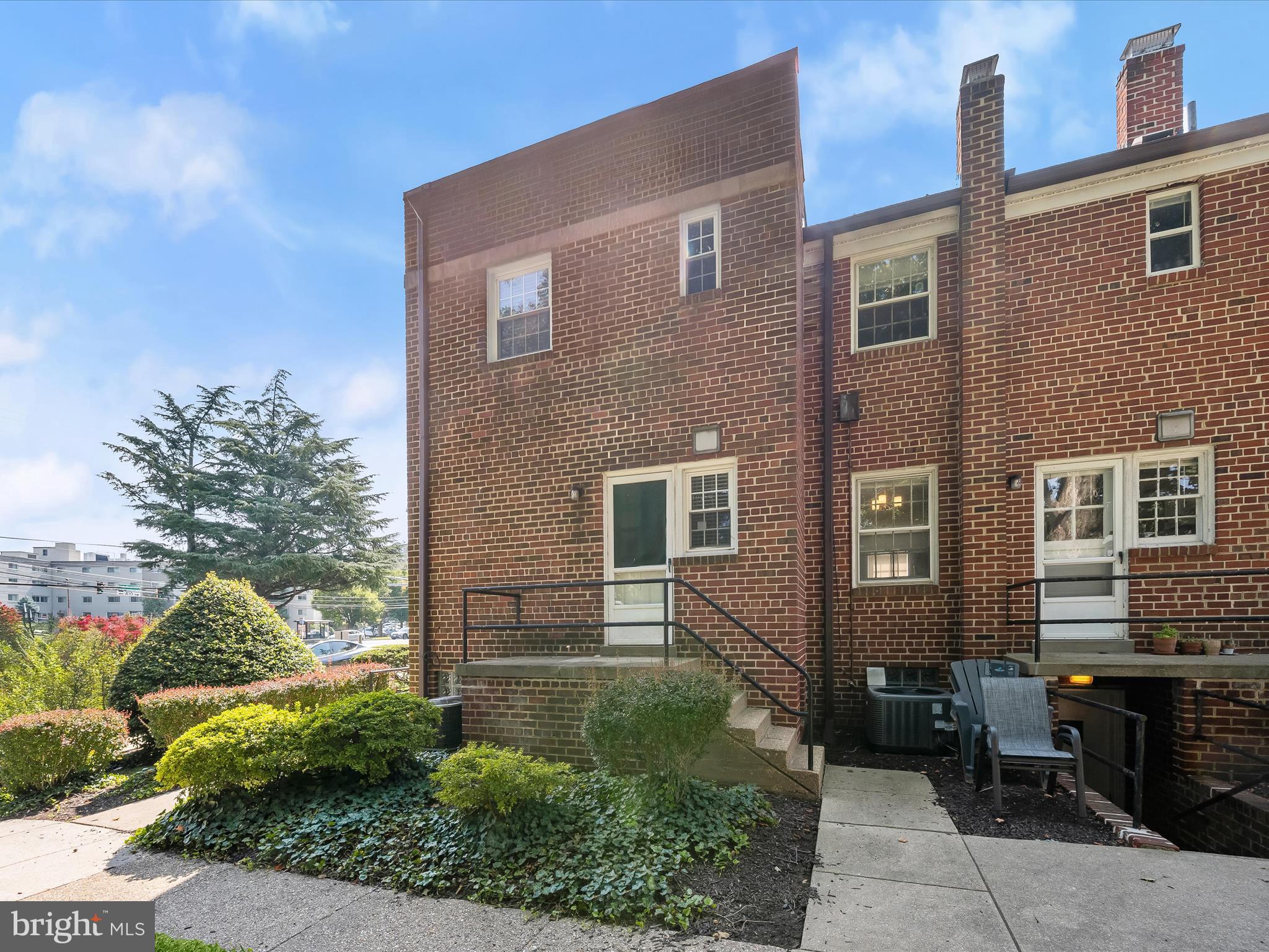1776 East W Highway, Unit 1776 Silver Spring, MD 20910 - Photo 27 of 31 a front view of a house with garden