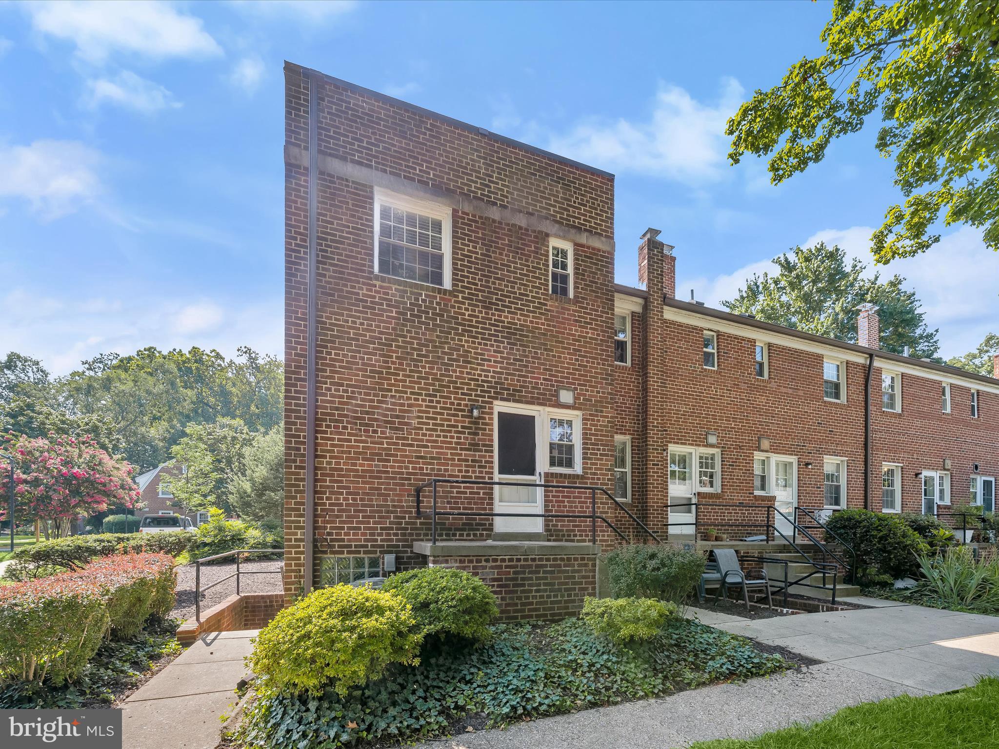 1776 East W Highway, Unit 1776 Silver Spring, MD 20910 - Photo 28 of 31 a front view of a house with a yard