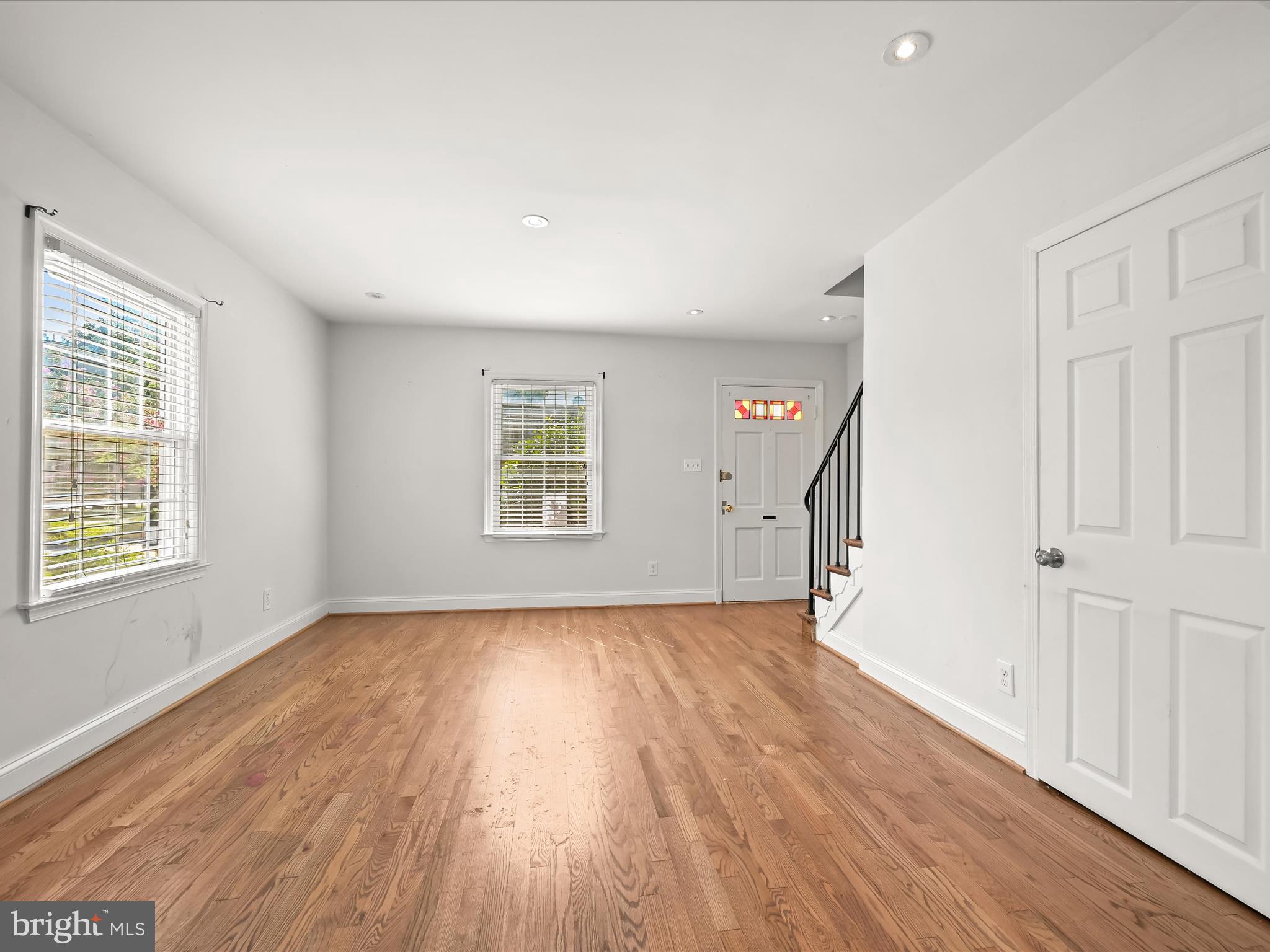 1776 East W Highway, Unit 1776 Silver Spring, MD 20910 - Photo 7 of 31 an empty room with wooden floor and windows