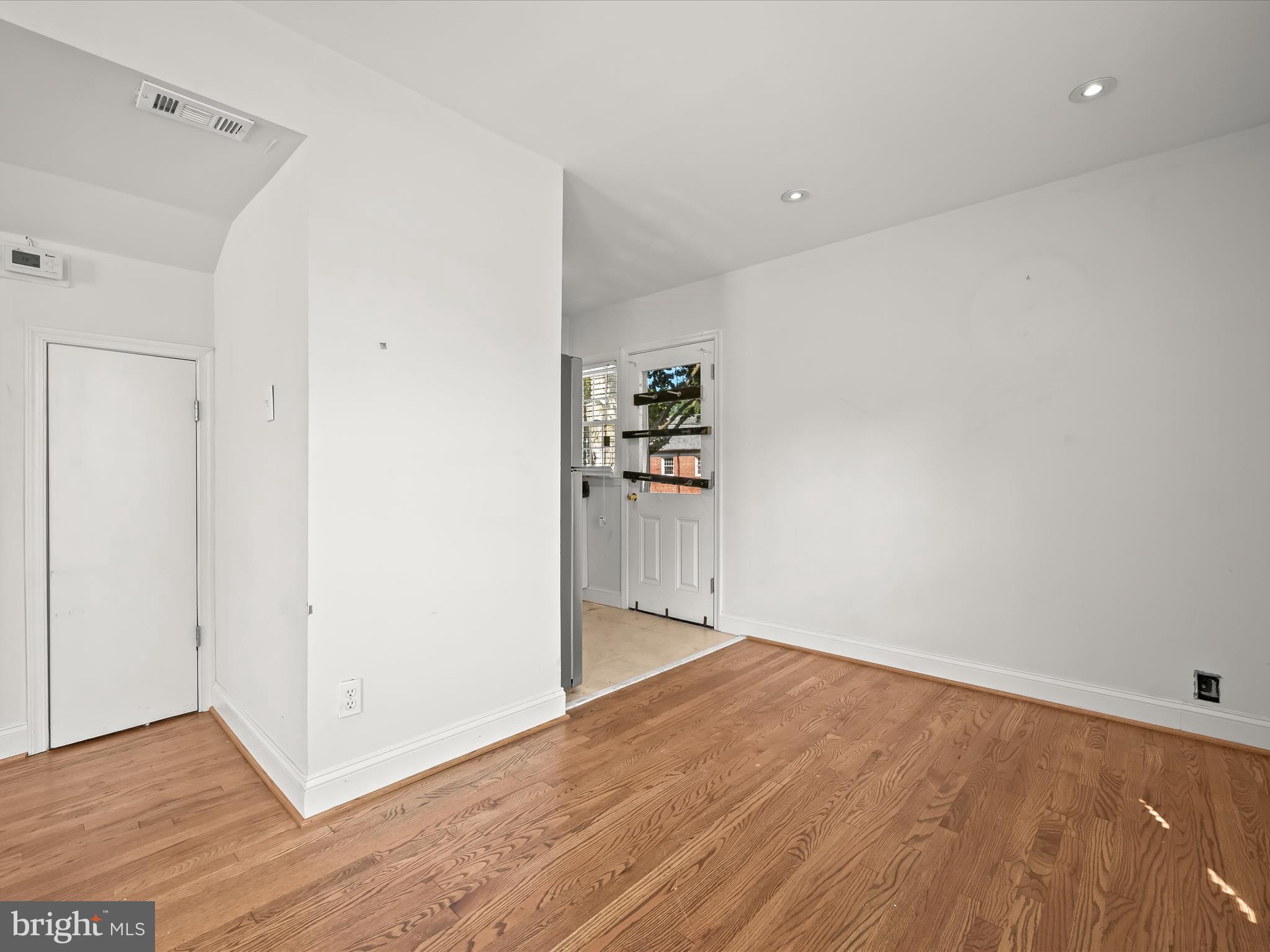1776 East W Highway, Unit 1776 Silver Spring, MD 20910 - Photo 9 of 31 a view of empty room with wooden floor