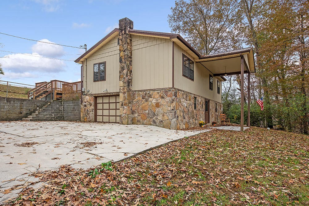 700 Butler Mill Road Oliver Springs, TN 37840 - Photo 3 of 16 a front view of a house with a yard