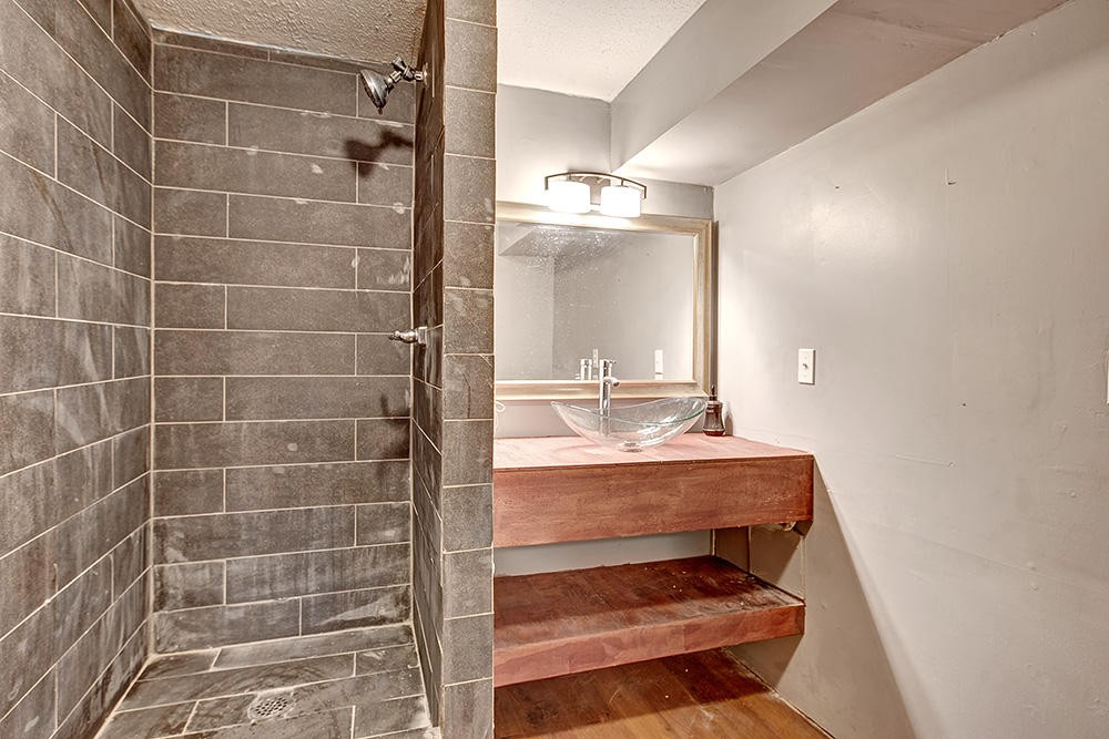 700 Butler Mill Road Oliver Springs, TN 37840 - Photo 8 of 16 a bathroom with a sink and a mirror