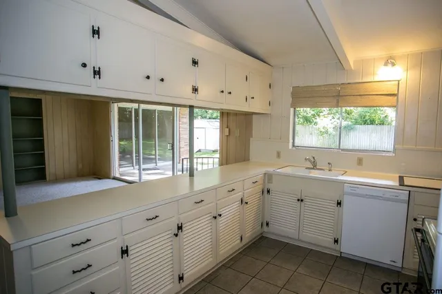 a kitchen with sink and window