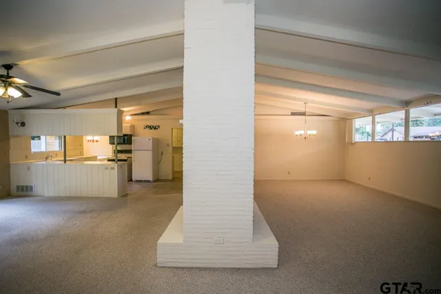 a view of a kitchen with a sink and cabinets