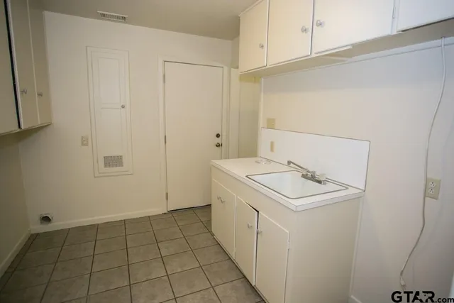 a utility room with washer and dryer