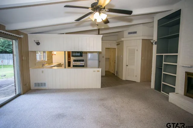 a view of a kitchen with furniture and a kitchen