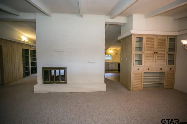 a view of a hallway with seating area