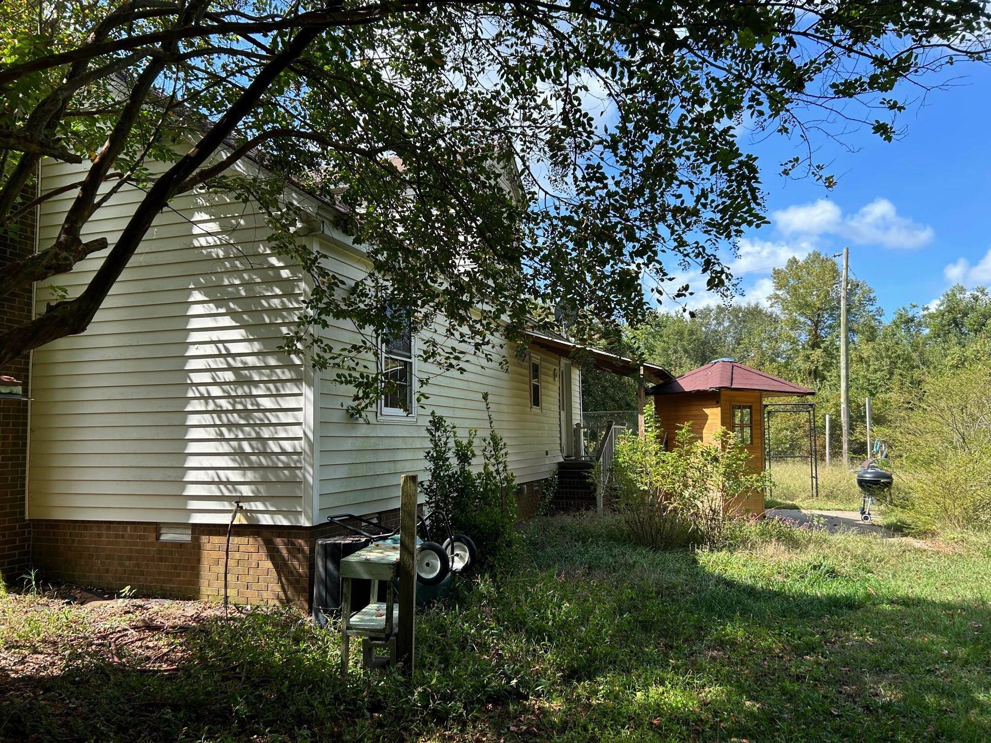 1507 Wilson Road Clinton, NC 28328 - Photo 5 of 49 a view of a back yard of the house