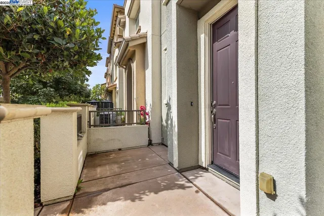a view of a door and chair in the balcony