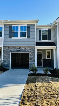 a front view of a house with yard
