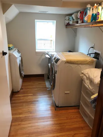 a room with wooden door and chair