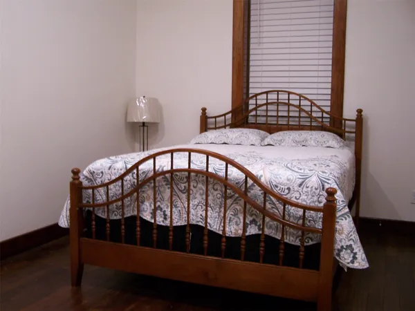 a view of a bedroom with a bed