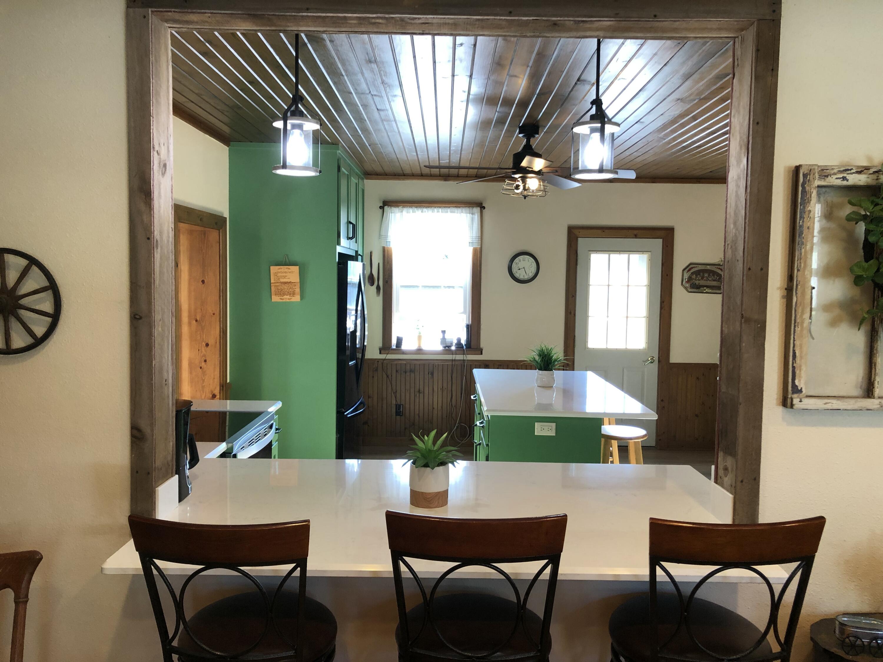 2729 County Rd MM Herman, WI 53083 - Photo 14 of 45 View into the kitchen from the breakfast bar.