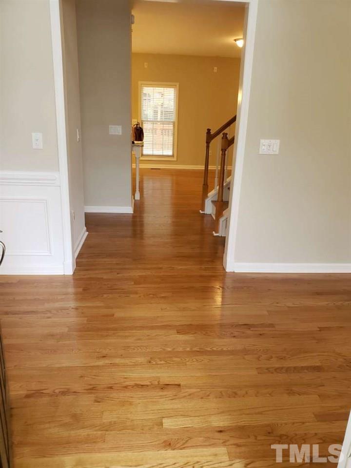 1208 Blackburn Road Apex, NC 27502 - Photo 3 of 26 looking down the hall into your family room.