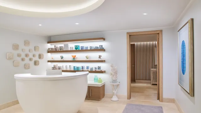 a room with a dining table wooden floor and a large window