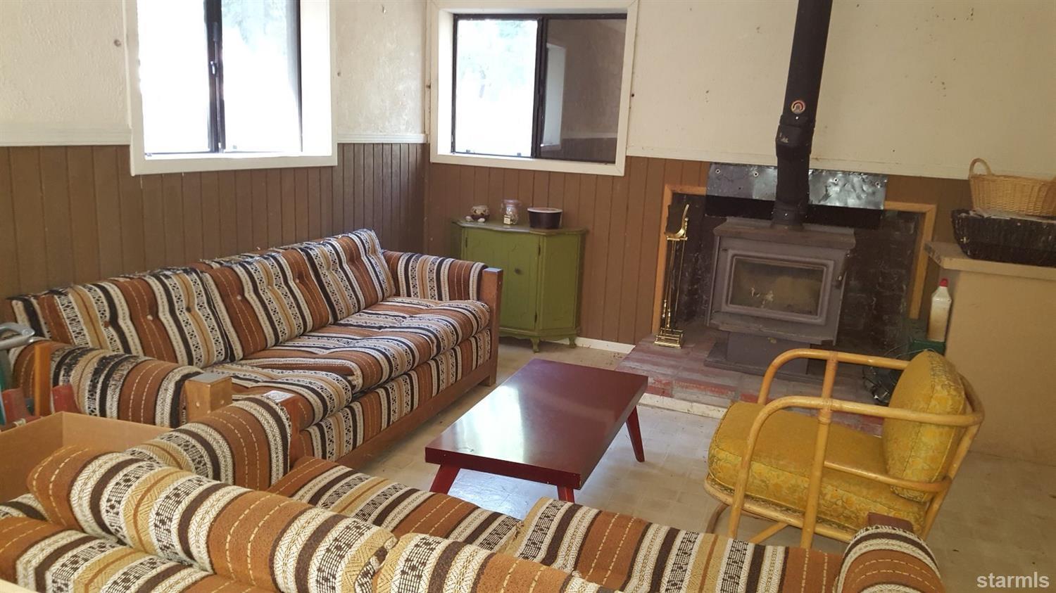 Living/sleeping area - wood burning fireplace.