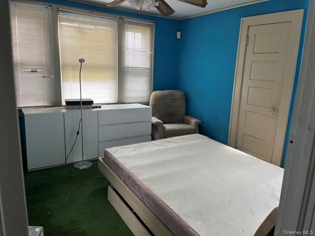 42-36 156th Street Queens, NY 11355 - Photo 11 of 12 a bedroom with a bed and a window