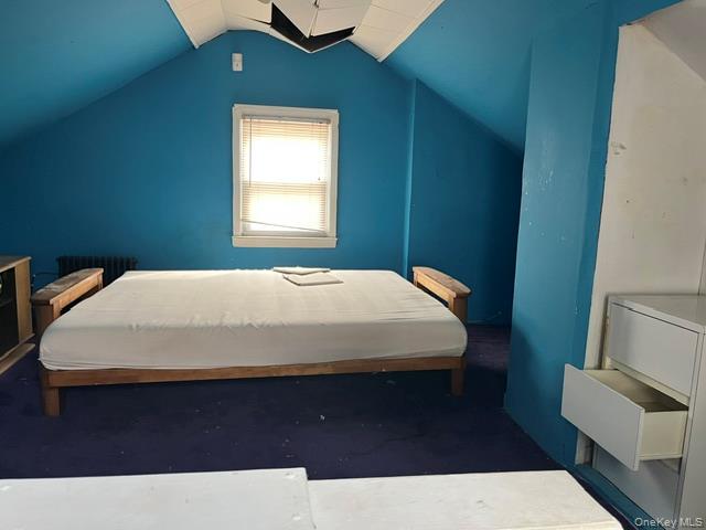 42-36 156th Street Queens, NY 11355 - Photo 12 of 12 a bedroom with a bed and a window