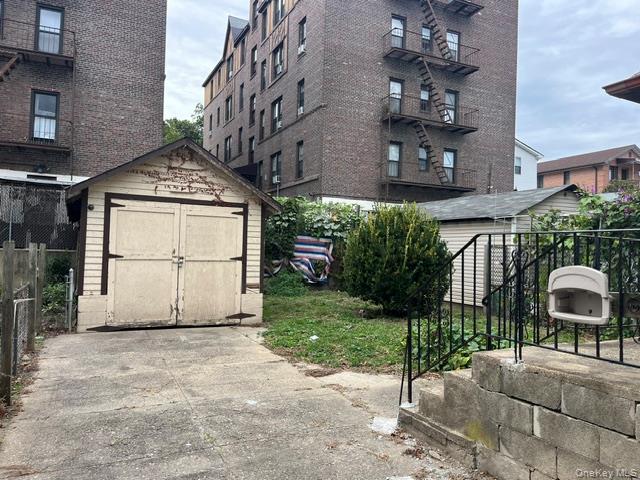42-36 156th Street Queens, NY 11355 - Photo 2 of 12 a front view of a house with garden