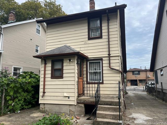 42-36 156th Street Queens, NY 11355 - Photo 3 of 12 a view of a house with more windows and stairs