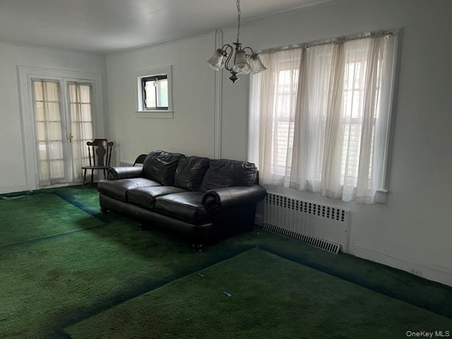42-36 156th Street Queens, NY 11355 - Photo 6 of 12 a living room with furniture and a window