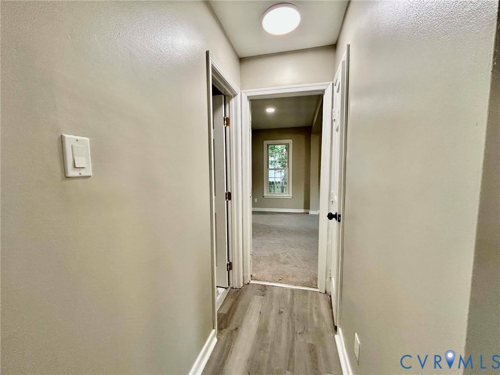 7110 Manning Road Chesterfield, VA 23832 - Photo 36 of 50 Hallway featuring wood-finish flooring, light neut