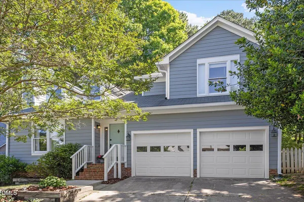 a front view of a house with garage