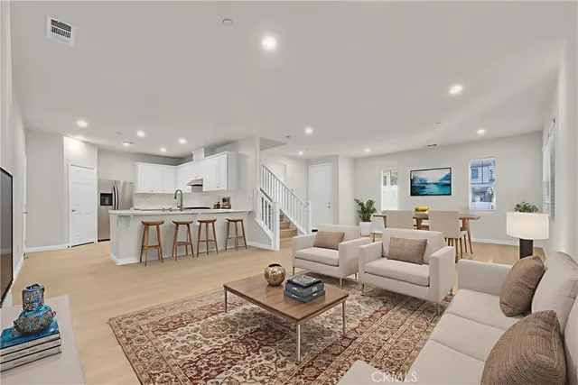 a living room with furniture and a rug