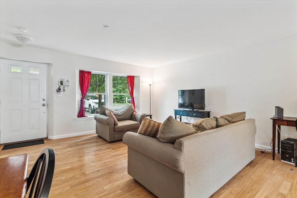 6 Bates Street, Unit B Devens, MA 01434 - Photo 11 of 30 a living room with furniture and a flat screen tv