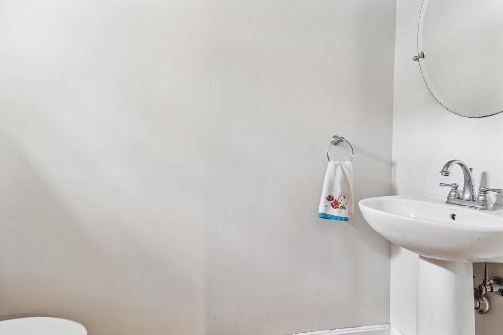 6 Bates Street, Unit B Devens, MA 01434 - Photo 12 of 30 a bathroom with a sink and a mirror