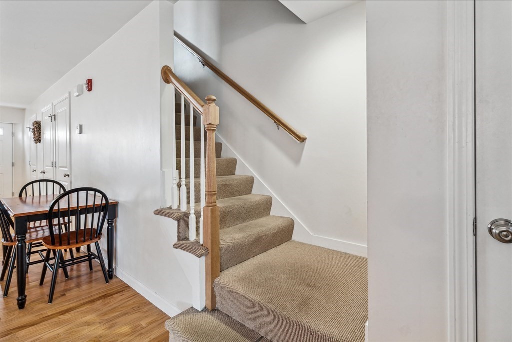 6 Bates Street, Unit B Devens, MA 01434 - Photo 13 of 30 a view of entryway and hall with wooden floor