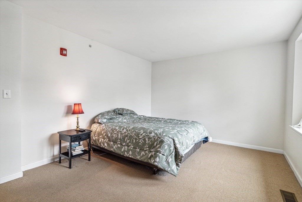 6 Bates Street, Unit B Devens, MA 01434 - Photo 15 of 30 a bedroom with a bed and a window