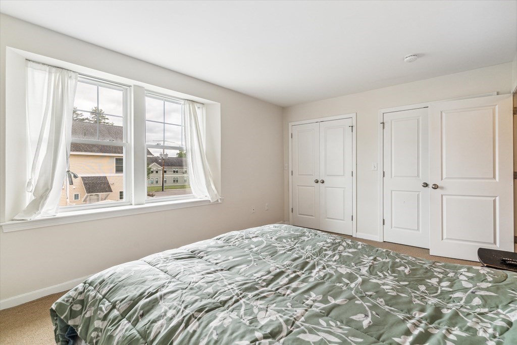 6 Bates Street, Unit B Devens, MA 01434 - Photo 16 of 30 a bedroom with a bed and a window