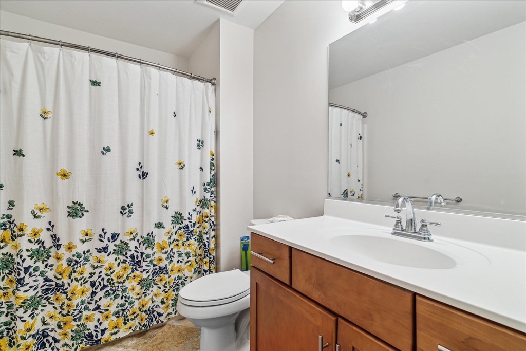 6 Bates Street, Unit B Devens, MA 01434 - Photo 18 of 30 a bathroom with a sink toilet and shower
