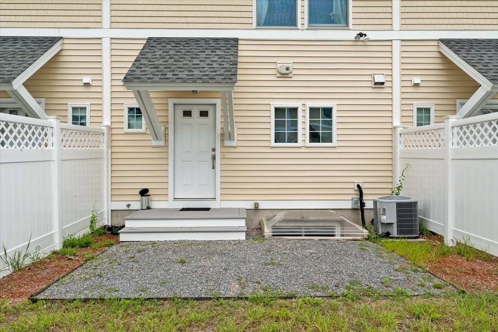 6 Bates Street, Unit B Devens, MA 01434 - Photo 26 of 30 a view of a house with backyard and chairs