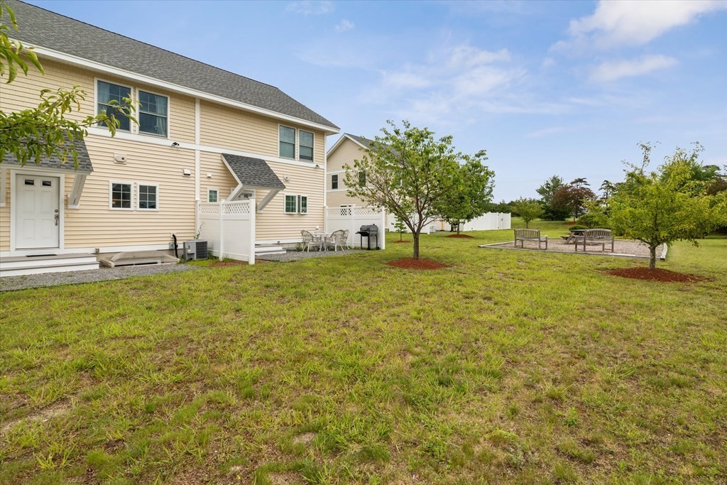 6 Bates Street, Unit B Devens, MA 01434 - Photo 28 of 30 a view of a house with a yard and garage