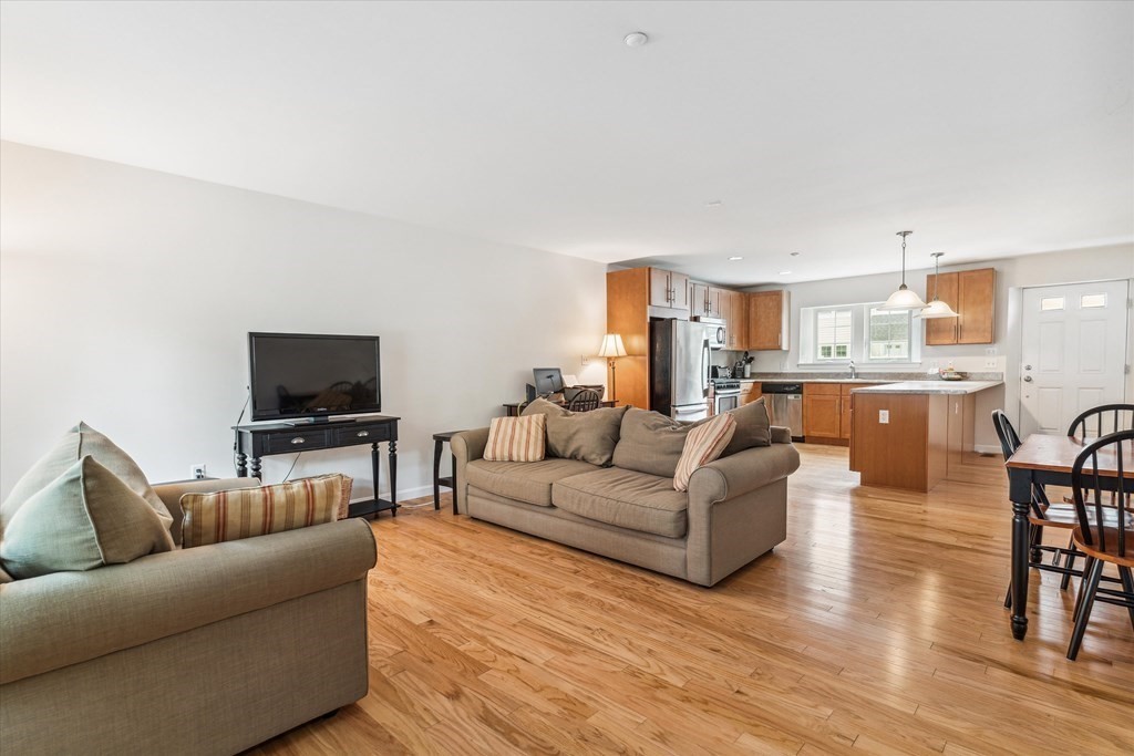 6 Bates Street, Unit B Devens, MA 01434 - Photo 7 of 30 a living room with furniture and a flat screen tv