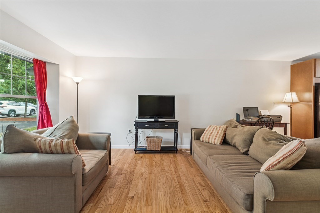6 Bates Street, Unit B Devens, MA 01434 - Photo 10 of 30 a living room with furniture and a flat screen tv