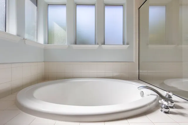 a white bath tub sitting in a bathroom